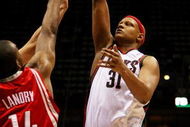 MILWAUKEE - FEBRUARY 09: Charlie Villanueva #31 of the Milwaukee Bucks puts up a shot over Carl Landry #14 of the Houston Rockets on February 9, 2009 at the Bradley Center in Milwaukee, Wisconsin. The Bucks defeated the Rockets 124-112. NOTE TO USER: User expressly acknowledges and agreees that, by downloading and/or using this Photograph, User is consenting to the terms and conditions of the Getty Images License Agreement. (Photo by Jonathan Daniel/Getty Images)