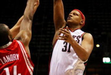 MILWAUKEE - FEBRUARY 09: Charlie Villanueva #31 of the Milwaukee Bucks puts up a shot over Carl Landry #14 of the Houston Rockets on February 9, 2009 at the Bradley Center in Milwaukee, Wisconsin. The Bucks defeated the Rockets 124-112. NOTE TO USER: User expressly acknowledges and agreees that, by downloading and/or using this Photograph, User is consenting to the terms and conditions of the Getty Images License Agreement. (Photo by Jonathan Daniel/Getty Images)