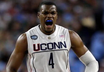 DETROIT - APRIL 04:  Jeff Adrien #4 of the Connecticut Huskies reacts in the first half while taking on the Michigan State Spartans during the National Semifinal game of the NCAA Division I Men's Basketball Championship at Ford Field on April 4, 2009 in Detroit, Michigan.  (Photo by Andy Lyons/Getty Images)
