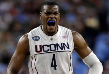 DETROIT - APRIL 04:  Jeff Adrien #4 of the Connecticut Huskies reacts in the first half while taking on the Michigan State Spartans during the National Semifinal game of the NCAA Division I Men's Basketball Championship at Ford Field on April 4, 2009 in Detroit, Michigan.  (Photo by Andy Lyons/Getty Images)