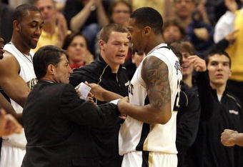 WINSTON-SALEM, NC - FEBRUARY 26:  Head coach Dino Gaudio celebrates with his player James Johnson #23 of the Wake Forest Demon Deacons during their 85-78 victory over the North Carolina State Wolfpack at Lawrence Joel Coliseum on February 26, 2009 in Winston-Salem, North Carolina.  (Photo by Streeter Lecka/Getty Images)