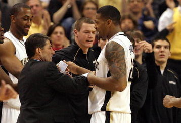 WINSTON-SALEM, NC - FEBRUARY 26:  Head coach Dino Gaudio celebrates with his player James Johnson #23 of the Wake Forest Demon Deacons during their 85-78 victory over the North Carolina State Wolfpack at Lawrence Joel Coliseum on February 26, 2009 in Winston-Salem, North Carolina.  (Photo by Streeter Lecka/Getty Images)
