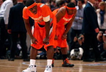 NEW YORK - MARCH 12:  Jonny Flynn #10 and Paul Harris #11 of the Syracuse Orange look on during the 4th overtime against the Connecticut Huskies during the quarterfinals of the Big East Tournament at Madison Square Garden on March 12, 2009 in New York City.  (Photo by Jim McIsaac/Getty Images)