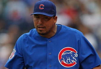 CHICAGO - MAY 27: Starting pitcher Carlos Zambrano #38 of the Chicago Cubs walks to the dugout after being thrown out of a game in the 7th inning against the Pittsburgh Pirates as pitching coach Larry Rothschild watches on May 27, 2009 at Wrigley Field in Chicago, Illinois. The Cubs defeated the Pirates 5-2.  (Photo by Jonathan Daniel/Getty Images)