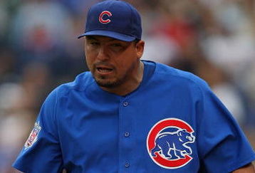 CHICAGO - MAY 27: Starting pitcher Carlos Zambrano #38 of the Chicago Cubs walks to the dugout after being thrown out of a game in the 7th inning against the Pittsburgh Pirates as pitching coach Larry Rothschild watches on May 27, 2009 at Wrigley Field in Chicago, Illinois. The Cubs defeated the Pirates 5-2.  (Photo by Jonathan Daniel/Getty Images)