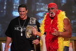 UNIVERSAL CITY, CA - AUGUST 14:  Wrestlers John Cena and Hulk Hogan present an award onstage at the 2005 Teen Choice Awards held at Gibson Amphitheatre at Universal CityWalk on August 14, 2005 in Universal City, California.  (Photo by Kevin Winter/Getty Images)