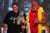 UNIVERSAL CITY, CA - AUGUST 14: Wrestlers John Cena and Hulk Hogan present an award onstage at the 2005 Teen Choice Awards held at Gibson Amphitheatre at Universal CityWalk on August 14, 2005 in Universal City, California. (Photo by Kevin Winter/Getty Images)