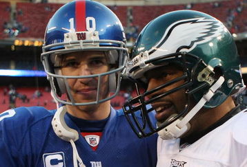 EAST RUTHERFORD, NJ - DECEMBER 07:  Eli Manning #10 of the New York Giants meets with Donovan McNabb #5 of the Philadelphia Eagles at the conclusion of their game at Giants Stadium on December 7, 2008 in East Rutherford, New Jersey.  (Photo by Nick Laham/Getty Images)