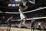 CLEVELAND - MAY 07:  LeBron James #23 of the Cleveland Cavaliers gets in for a first quarter dunk between Maurice Evans #1 and Solomon Jones #44 of the Atlanta Hawks during Game Two of the Eastern Conference Semifinals during the 2009 NBA Playoffs at Quicken Loans Arena on May 7, 2009 in Cleveland, Ohio.  NOTE TO USER: User expressly acknowledges and agrees that, by downloading and or using this photograph, User is consenting to the terms and conditions of the Getty Images License Agreement.  (Photo by Gregory Shamus/Getty Images)