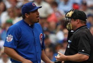 CHICAGO - JUNE 18: Carlos Zambrano #38 of the Chicago Cubs talks with home plate umpire Bruce Dreckman #1 after hitting batter Gordon Beckham of the Chicago White Sox in the 2nd inning on June 18, 2009 at Wrigley Field in Chicago, Illinois. The Cubs defeated the White Sox 6-5. (Photo by Jonathan Daniel/Getty Images)