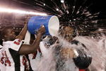 SAN DIEGO, CA - DECEMBER 30:  Defensive end Randall Cherry #84 drenches assistant head coach Ruffin McNeill of the Texas Tech Red Raiders en route to his team's 45-31 win over the California Golden Bears during the Pacific Life Holiday Bowl at Qualcomm Stadium on December 30, 2004 in San Diego, California.  (Photo by Donald Miralle/Getty Images)