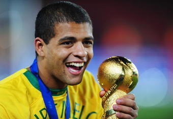 JOHANNESBURG, SOUTH AFRICA - JUNE 28:  Felipe Melo of Brazil holds the trophy following his team's victory at the end of the FIFA Confederations Cup Final between USA and Brazil at the Ellis Park Stadium on June 28, 2009 in Johannesburg, South Africa.  (Photo by Laurence Griffiths/Getty Images)