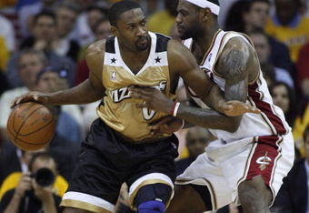CLEVELAND - APRIL 21:  Gilbert Arenas #0 of the Washington Wizards tries to get around LeBron James #23 of the Cleveland Cavaliers in Game Two of the Eastern Conference Quarterfinals during the 2008 NBA Playoffs at Quicken Loans Arena April 21, 2008 in Cleveland, Ohio.  NOTE TO USER: User expressly acknowledges and agrees that, by downloading and or using this photograph, User is consenting to the terms and conditions of the Getty Images License Agreement.  (Photo by Gregory Shamus/Getty Images)