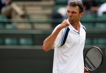 WIMBLEDON, ENGLAND - JUNE 26:  Ivo Karlovic of Croatia celebrates during the men's singles third round match against Jo-Wilfried Tsonga of France  on Day Five of the Wimbledon Lawn Tennis Championships at the All England Lawn Tennis and Croquet Club on June 26, 2009 in London, England.  (Photo by Clive Brunskill/Getty Images)