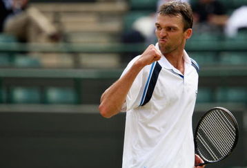 WIMBLEDON, ENGLAND - JUNE 26:  Ivo Karlovic of Croatia celebrates during the men's singles third round match against Jo-Wilfried Tsonga of France  on Day Five of the Wimbledon Lawn Tennis Championships at the All England Lawn Tennis and Croquet Club on June 26, 2009 in London, England.  (Photo by Clive Brunskill/Getty Images)