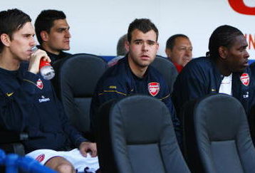 PORTSMOUTH, UNITED KINGDOM - MAY 02: (L-R) Fran Marida, Mark Randall, Vito Mannone, Amaury Bischoff, Jay Thomas, Francis Coquelin and Emmanuel Frimpong of Arsenal look on from the bench prior to the Barclays Premier League match between Portsmouth and Arsenal at Fratton Park on May 2, 2009 in Portsmouth, England. (Photo by Paul Gilham/Getty Images)