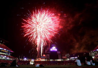 DENVER - JULY 03:  Baseball fans watch a fireworks display on the eve of the 4th of July after the Colorado Rockies defeated the New York Mets 11-3 at Coors Field on July 3, 2007 in Denver, Colorado.  (Photo by Doug Pensinger/Getty Images)