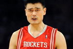 LOS ANGELES, CA - MAY 06:  Yao Ming #11 of the Houston Rockets reacts to a foul called on him in the second quarter against the Los Angeles Lakers in Game Two of the Western Conference Semifinals during the 2009 NBA Playoffs at Staples Center on May 6, 2009 in Los Angeles, California. NOTE TO USER: User expressly acknowledges and agrees that, by downloading and or using this photograph, User is consenting to the terms and conditions of the Getty Images License Agreement.  (Photo by Harry How/Getty Images)