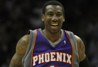 SAN ANTONIO - APRIL 29:  Amare Stoudemire #1 of the Phoenix Suns reacts to no foul called after his layup against the San Antonio Spurs during the second quarter in Game Five of the Western Conference Quarterfinals during the 2008 NBA Playoffs at the AT&T Center on April 29, 2008 in San Antonio, Texas.  NOTE TO USER: User expressly acknowledges and agrees that, by downloading and or using this photograph, User is consenting to the terms and conditions of the Getty Images License Agreement.  (Photo by Harry How/Getty Images)  