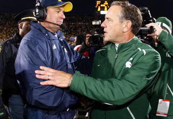 ANN ARBOR, MI - OCTOBER 25: Head coach Mark Dantonio of the Michigan State Spartans shakes hands with head coach Rich Rodriguez of the Michigan Wolverines after a Michigan State 35-21 victory on October 25, 2008 at Michigan Stadium in Ann Arbor, Michigan.  (Photo by Gregory Shamus/Getty Images)