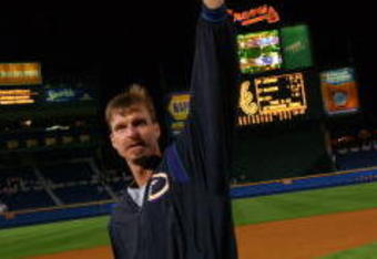 21 Oct 2001:  Randy Johnson #51 of the Arizona Diamondbacks tips his cap as he leaves the field as Diamondbacks celebrate their 3-2 victory over the Atlanta Braves in game five to win the National League Champsionship Series at Turner Field in Atlanta, Georgia. DIGITAL IMAGE. Mandatory Credit: Doug Pensinger/ALLSPORT