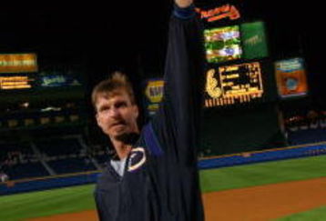 21 Oct 2001:  Randy Johnson #51 of the Arizona Diamondbacks tips his cap as he leaves the field as Diamondbacks celebrate their 3-2 victory over the Atlanta Braves in game five to win the National League Champsionship Series at Turner Field in Atlanta, Georgia. DIGITAL IMAGE. Mandatory Credit: Doug Pensinger/ALLSPORT