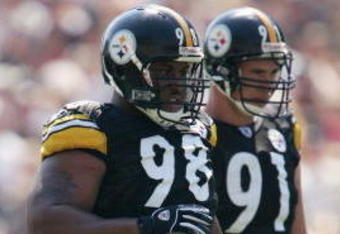 PITTSBURGH - SEPTEMBER 12:  Nose tackle Casey Hampton #98 of the Pittsburgh Steelers stands next to his teammate defensive end Aaron Smith #91 during the game against the Oakland Raiders at Heinz Field on September 12, 2004 in Pittsburgh, Pennsylvania. The Steelers defeated the Raiders 24-21. (Photo by Andy Lyons/Getty Images)