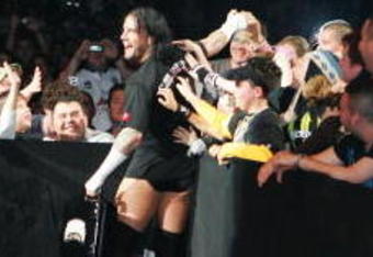 SYDNEY, AUSTRALIA - JUNE 15:  CM Punk celebrates with fans before facing Shelton Benjamin during WWE Smackdown at Acer Arena on June 15, 2008 in Sydney, Australia.  (Photo by Gaye Gerard/Getty Images)