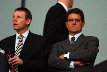 LONDON, ENGLAND - APRIL 15:  England Manager Fabio Capello (R) and England coach Stuart Pearce  look on prior to the UEFA Champions League Quarter Final Second Leg match between Arsenal and Villarreal at the Emirates Stadium on April 15, 2009 in London, England.  (Photo by Hamish Blair/Getty Images)