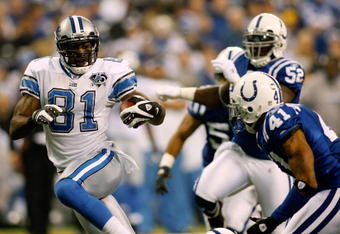INDIANAPOLIS - DECEMBER 14:  Calvin Johnson #81 of the Detroit Lions gets past Antoine Bethea #41 of the Indianapolis Colts to score a touchdown on December 14, 2008 at Lucas Oil Stadium in Indianapolis, Indiana.  (Photo by Chris Graythen/Getty Images)