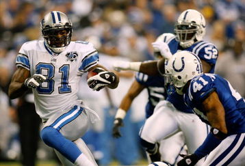 INDIANAPOLIS - DECEMBER 14:  Calvin Johnson #81 of the Detroit Lions gets past Antoine Bethea #41 of the Indianapolis Colts to score a touchdown on December 14, 2008 at Lucas Oil Stadium in Indianapolis, Indiana.  (Photo by Chris Graythen/Getty Images)