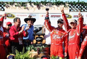 SONOMA, CA - JUNE 21: Kasey Kahne, driver of the #9 Budweiser Dodge, celebrates in victory lane with his team and owner Richard Petty after winning the NASCAR Sprint Cup Series Toyota/Save Mart 350 at the Infineon Raceway on June 21, 2009 in Sonoma, California.  (Photo by Christian Petersen/Getty Images for NASCAR)