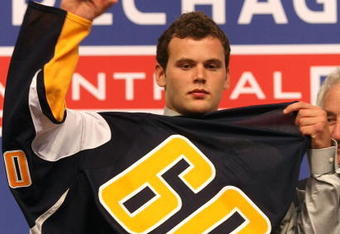 MONTREAL, QC - JUNE 26:  Zack Kassian puts on his new Buffalo Sabres sweater after he was selected #13 overall by the Sabres during the first round of the 2009 NHL Entry Draft at the Bell Centre on June 26, 2009 in Montreal, Quebec, Canada.  (Photo by Bruce Bennett/Getty Images)