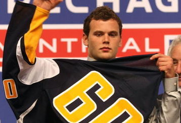 MONTREAL, QC - JUNE 26:  Zack Kassian puts on his new Buffalo Sabres sweater after he was selected #13 overall by the Sabres during the first round of the 2009 NHL Entry Draft at the Bell Centre on June 26, 2009 in Montreal, Quebec, Canada.  (Photo by Bruce Bennett/Getty Images)