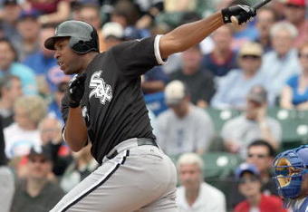 CHICAGO - JUNE 17: Jermaine Dye #23 of the Chicago White Sox makes a hit against the Chicago Cubs on June 17, 2009 at Wrigley Field in Chicago, Illinois. (Photo by Jonathan Daniel/Getty Images)