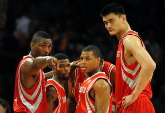 LOS ANGELES, CA - MAY 06:  (L-R) Ron Artest #96, Aaron Brooks #0, Kyle Lowry #7 and Yao Ming #11 of the Houston Rockets huddle against the Los Angeles Lakers in Game Two of the Western Conference Semifinals during the 2009 NBA Playoffs at Staples Center on May 6, 2009 in Los Angeles, California. NOTE TO USER: User expressly acknowledges and agrees that, by downloading and or using this photograph, User is consenting to the terms and conditions of the Getty Images License Agreement.  (Photo by Harry How/Getty Images)