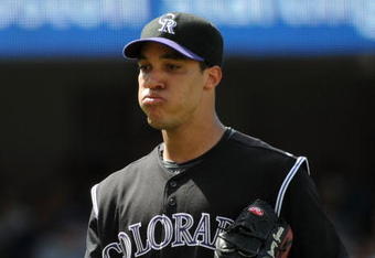LOS ANGELES, CA - APRIL 19:  Ubaldo Jimenez #38 of the Colorado Rockies reacts as he leaves the game against the Los Angeles Dodgers at Dodger Stadium on April 19, 2009 in Los Angeles, California.  (Photo by Harry How/Getty Images)