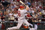 PHOENIX - JUNE 27:  Juan Rivera #20 of the Los Angeles Angels of Anaheim hits a single against the Arizona Diamondbacks during the major league baseball game at Chase Field on June 27, 2009 in Phoenix, Arizona. The Angels defeated the Diamondbacks 2-1.  (Photo by Christian Petersen/Getty Images)