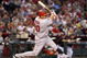 PHOENIX - JUNE 27:  Juan Rivera #20 of the Los Angeles Angels of Anaheim hits a single against the Arizona Diamondbacks during the major league baseball game at Chase Field on June 27, 2009 in Phoenix, Arizona. The Angels defeated the Diamondbacks 2-1.  (Photo by Christian Petersen/Getty Images)