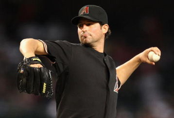 PHOENIX - JUNE 27:  Starting pitcher Doug Davis #49 of the Arizona Diamondbacks pitches against the Los Angeles Angels of Anaheim during the major league baseball game at Chase Field on June 27, 2009 in Phoenix, Arizona.  (Photo by Christian Petersen/Getty Images)