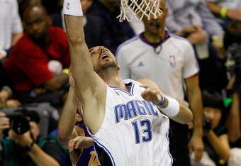ORLANDO, FL - JUNE 14:  Marcin Gortat #13 of the Orlando Magic puts a shot up in Game Five of the 2009 NBA Finals against the Los Angeles Lakers on June 14, 2009 at Amway Arena in Orlando, Florida.  The Lakers won 99-86.  NOTE TO USER:  User expressly acknowledges and agrees that, by downloading and or using this photograph, User is consenting to the terms and conditions of the Getty Images License Agreement.  (Photo by Chris Graythen/Getty Images)