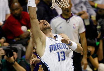 ORLANDO, FL - JUNE 14:  Marcin Gortat #13 of the Orlando Magic puts a shot up in Game Five of the 2009 NBA Finals against the Los Angeles Lakers on June 14, 2009 at Amway Arena in Orlando, Florida.  The Lakers won 99-86.  NOTE TO USER:  User expressly acknowledges and agrees that, by downloading and or using this photograph, User is consenting to the terms and conditions of the Getty Images License Agreement.  (Photo by Chris Graythen/Getty Images)