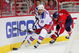 WASHINGTON - APRIL 28: Scott Gomez #19 of the New York Rangers skates the puck past Tom Poti #3 of the Washington Capitals during Game Seven of the Eastern Conference Quarterfinal Round of the 2009 Stanley Cup Playoffs on April 28, 2009 at the Verizon Center in Washington, DC. (Photo by Len Redkoles/Getty Images)