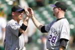 OAKLAND, CA - JUNE 28:  Aaron Cook #28 of the Colorado Rockies is congratulated by Clint Barmes #12 after they beat the Oakland Athletics at the Oakland Coliseum on June 28, 2009 in Oakland, California.  (Photo by Ezra Shaw/Getty Images)