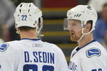 DETROIT - JANUARY 17:  The Sedin brothers Daniel #22 and Henrik #33 of the Vancouver Canucks chat prior to a faceoff in a game against the Detroit Red Wings on January 17, 2008 at the Joe Louis Arena in Detroit, Michigan. The Wings defeated the Canucks 3-2 in a shootout. (Photo by Claus Andersen/Getty Images)