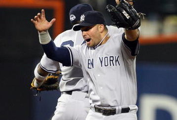NEW YORK - JUNE 27:  Nick Swisher #33 and Robinson Cano #24 of the New York Yankees celebrate after defeating the New York Mets on June 27, 2009 at Citi Field in the Flushing neighborhood of the Queens borough of New York City.  (Photo by Jim McIsaac/Getty Images)