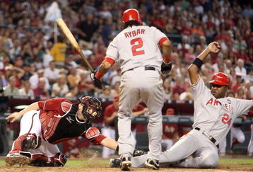 PHOENIX - JUNE 28:   Catcher Miguel Montero #26 of the Arizona Diamondbacks is unable to tag Gary Matthews #24 of the Los Angeles Angels of Anaheim as he steals home plate during the fourth inning of the major league baseball game at Chase Field on June 28, 2009 in Phoenix, Arizona.  (Photo by Christian Petersen/Getty Images)