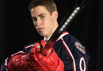 MONTREAL, QC - JUNE 26: John Moore of the Columbus Blue Jackets poses for a photo after he was selected #21 overall during the first round of the 2009 NHL Entry Draft at the Bell Centre on June 26, 2009 in Montreal, Quebec, Canada. (Photo by Jamie Squire/Getty Images)