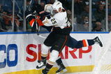 UNIONDALE, NY - JANUARY 21:  Chris Pronger #25 of the Anaheim Ducks throws a hit against Blake Comeau #57 of the New York Islanders on January 21, 2009 at Nassau Coliseum in Uniondale, New York.  (Photo by Jim McIsaac/Getty Images)