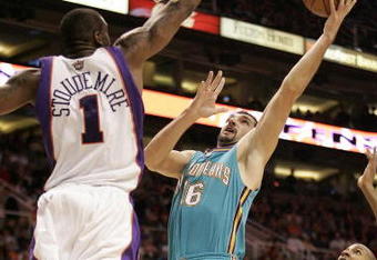 PHOENIX - FEBRUARY 6:  Peja Stojakovic #16 of the New Orleans Hornets shoots over Amare' Stoudemire #1 of the Phoenix Suns on February 6, 2008 at US Airways Center in Phoenix, Arizona. NOTE TO USER: User expressly acknowledges and agrees that, by downloading and or using this Photograph, user is consenting to the terms and conditions of the Getty Images License Agreement.(Photo by Domenic Centofanti/Getty Images)